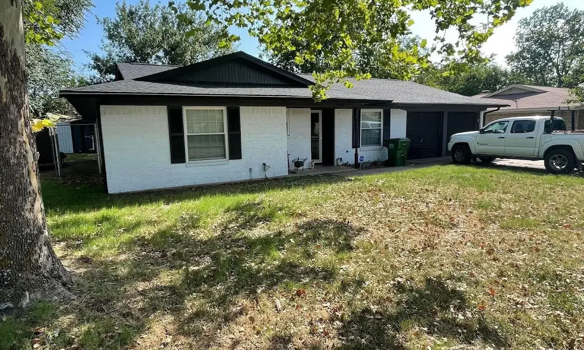 Professional roofing crew working on a residential roof in Hopkins